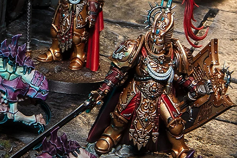 A painted miniature in gold armor